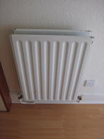 Central heating radiator photographed from above.